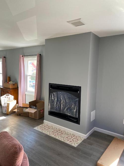 Built the frame and finished the gas fireplace with custom tile detailing.